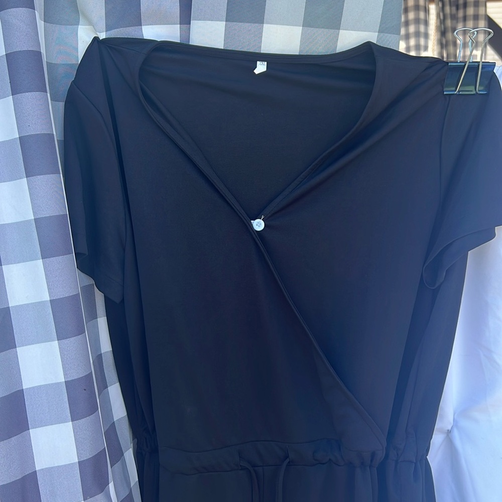 Brand new, never worn. Short sleeve jumpsuit 2XL